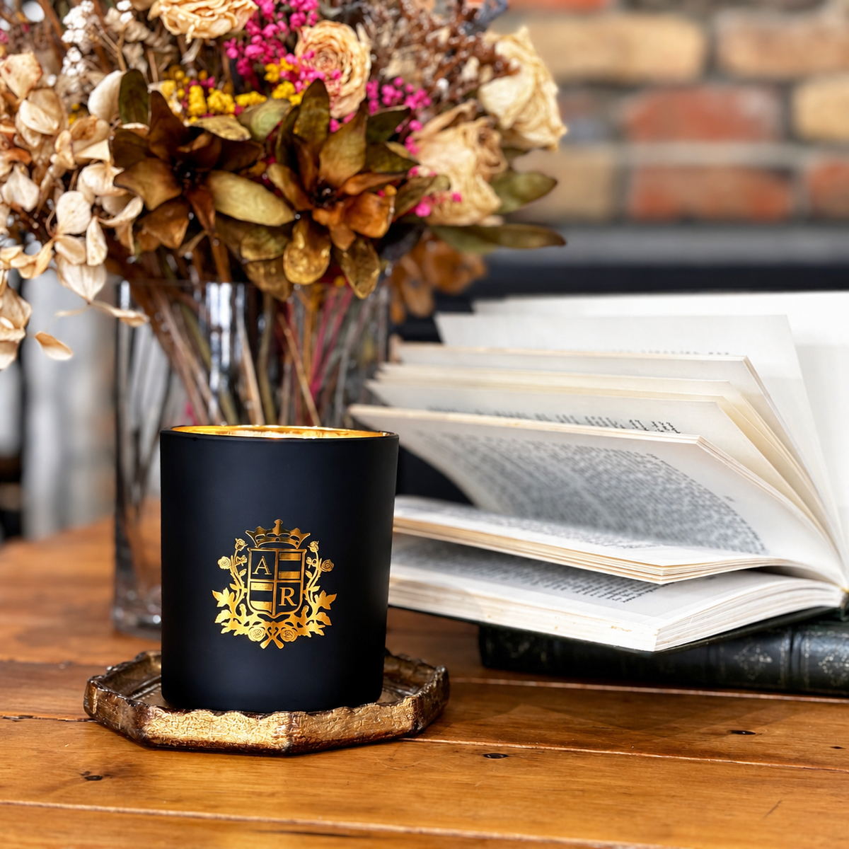 Black and gold scented candle on coffee table