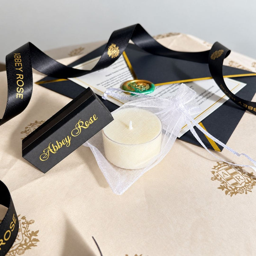 Free gift sample soy tealight and Abbey Rose custom matchbox with black and gold ribbon, NZ made