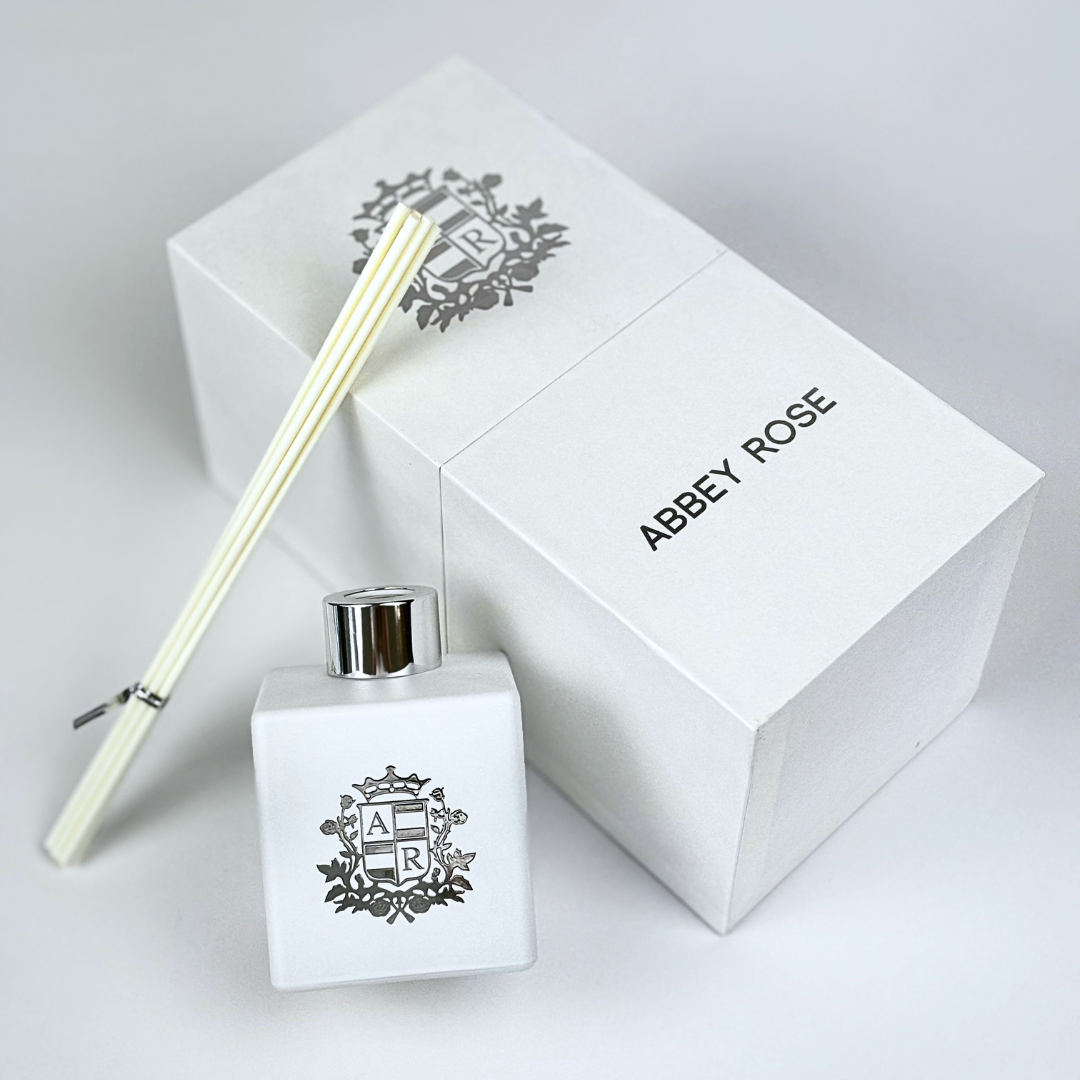 White Abey Rose diffuser next to gift box