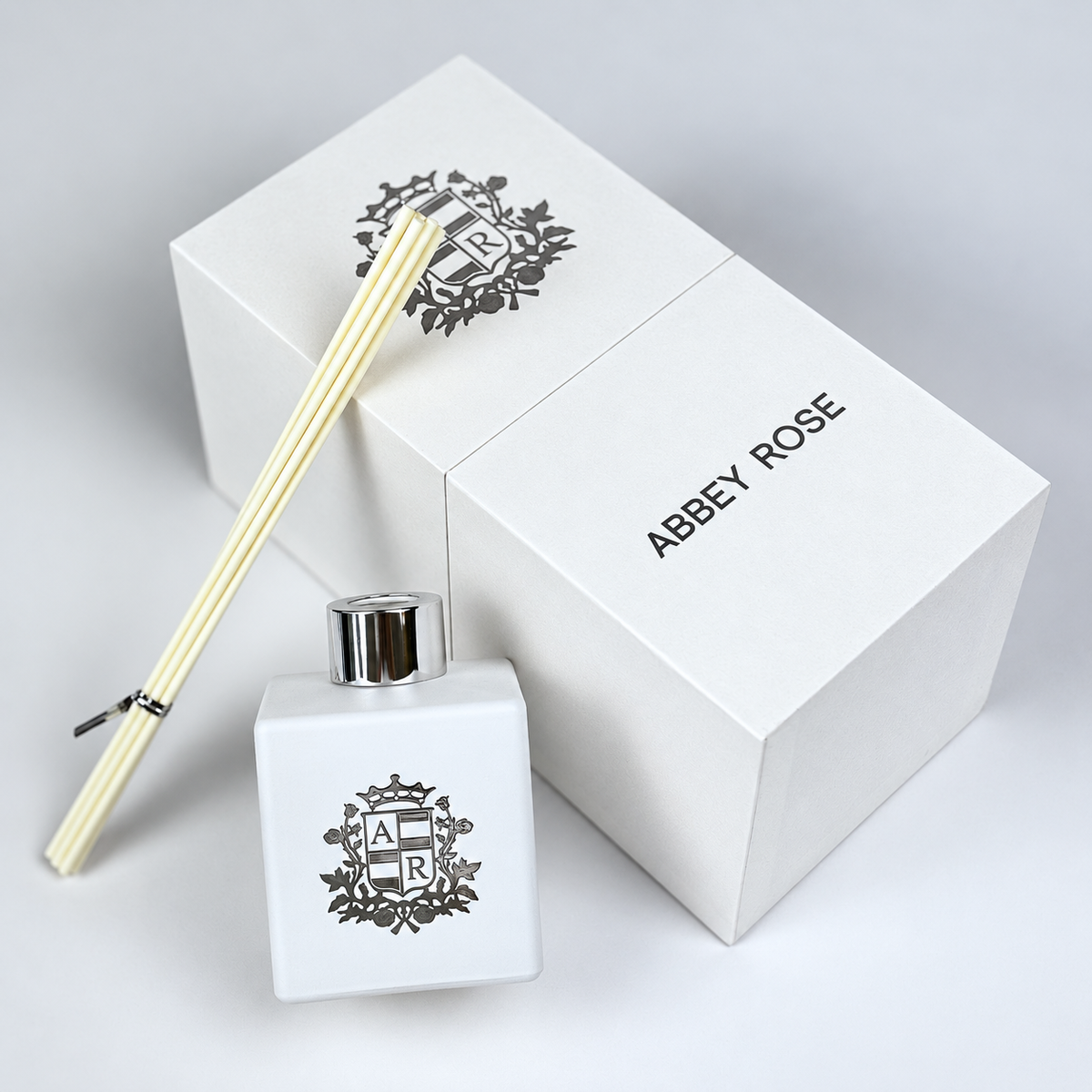 White Abey Rose diffuser next to gift box